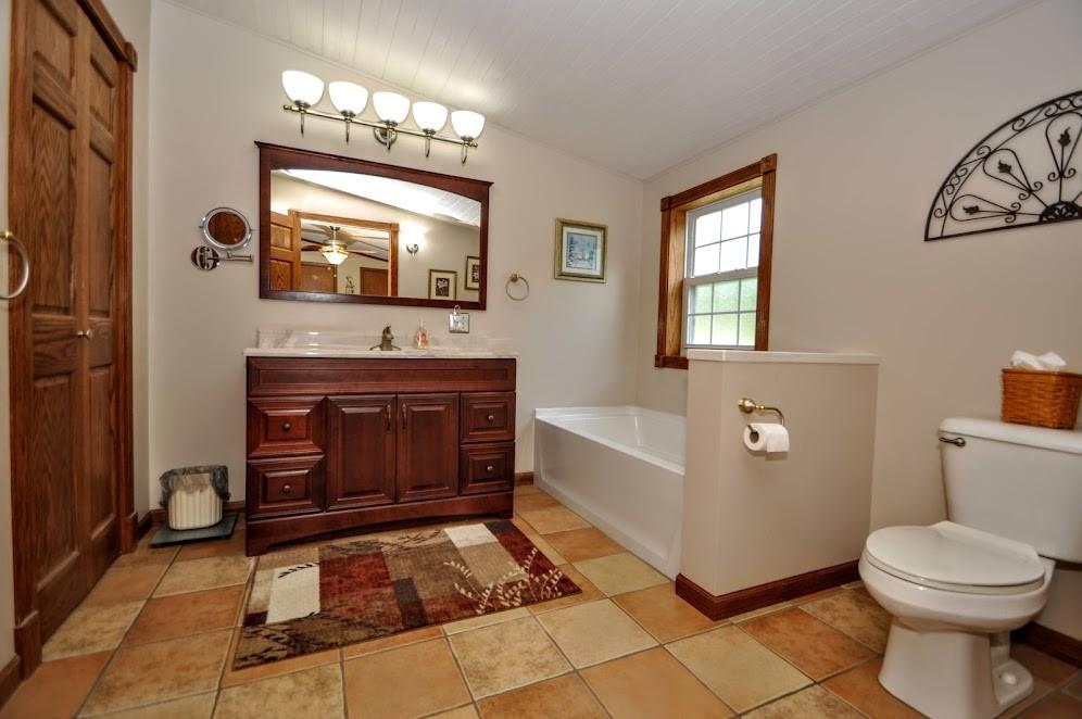 311 Cope Road Perryopolis, PA 15473 - Photo 21 of 47 a bathroom with a sink toilet and mirror