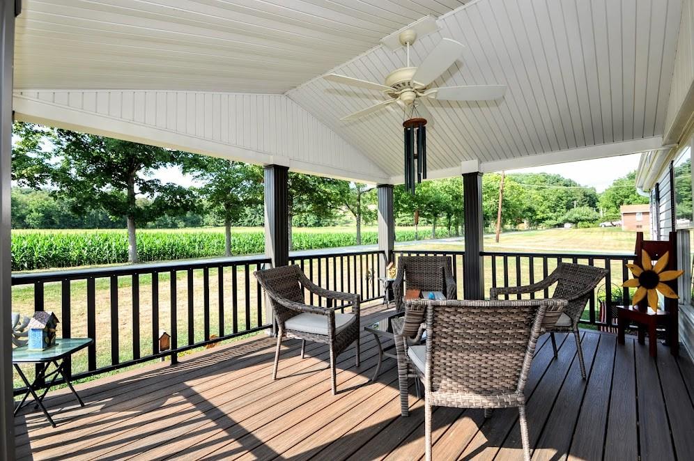 311 Cope Road Perryopolis, PA 15473 - Photo 3 of 47 a view of a patio with a table chairs and wooden floor