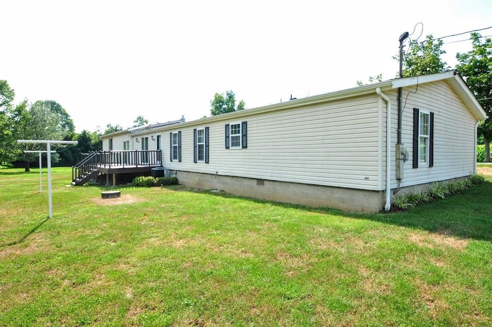 311 Cope Road Perryopolis, PA 15473 - Photo 34 of 47 a backyard of a house with barbeque oven and table and chairs