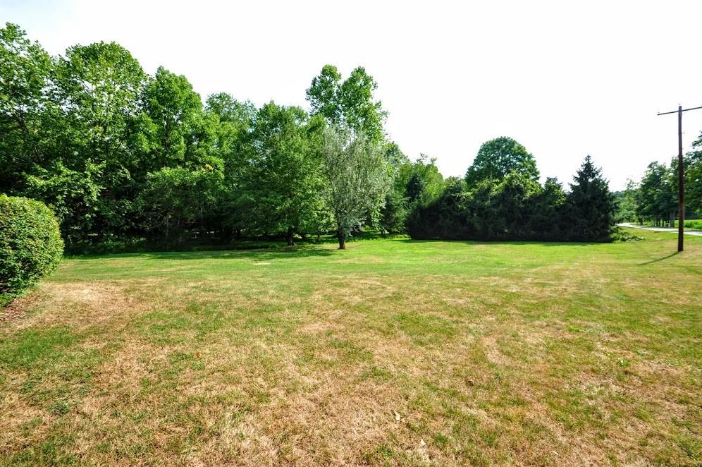 311 Cope Road Perryopolis, PA 15473 - Photo 39 of 47 a view of a green field with trees in the background