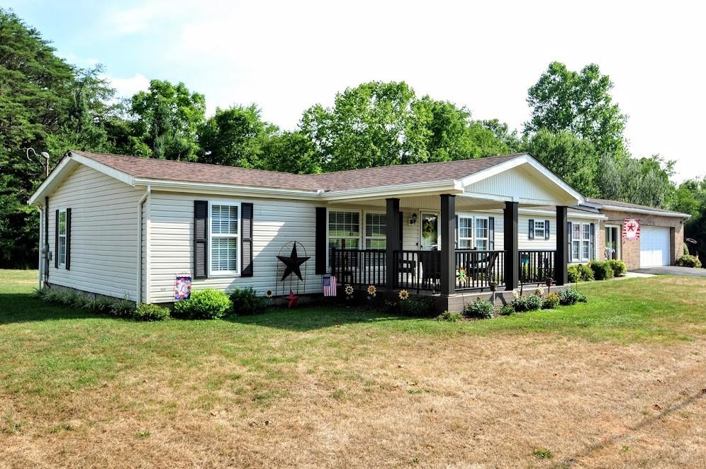 311 Cope Road Perryopolis, PA 15473 - Photo 44 of 47 a front view of a house with garden