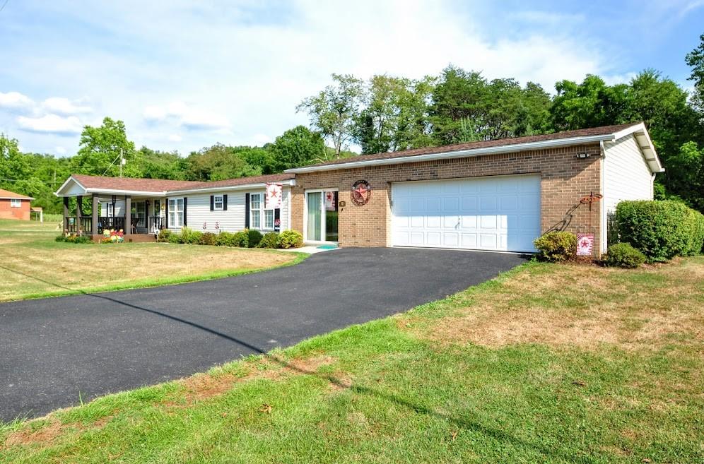 311 Cope Road Perryopolis, PA 15473 - Photo 47 of 47 a view of a house with a patio and a yard