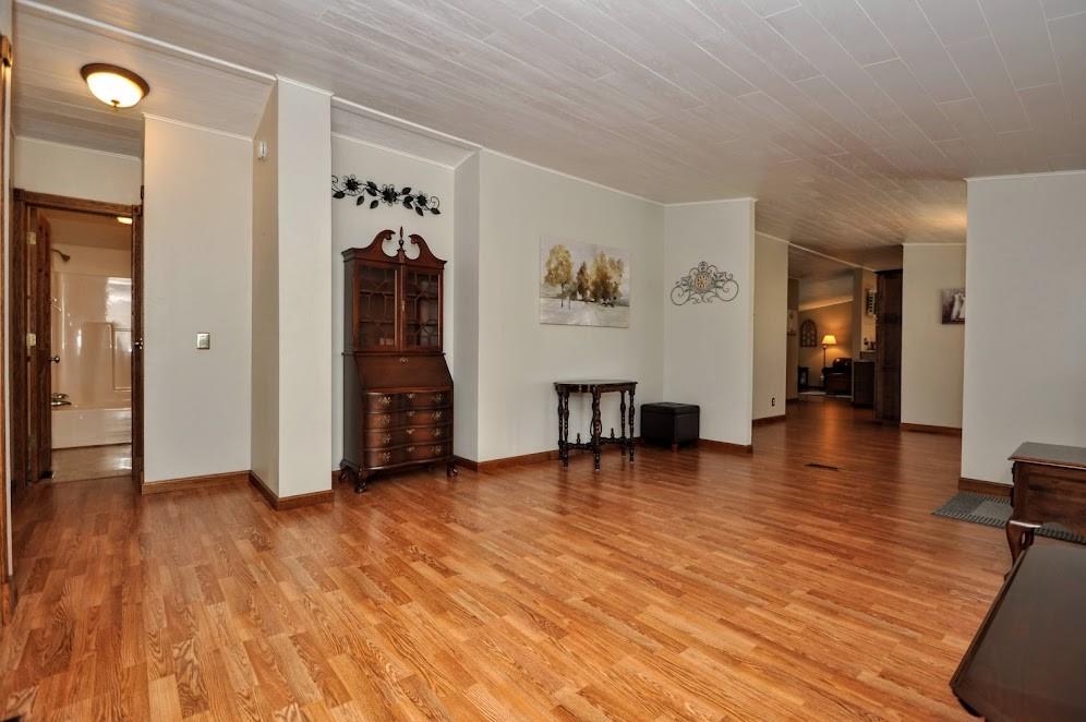 311 Cope Road Perryopolis, PA 15473 - Photo 6 of 47 a view of a livingroom with wooden floor and closet