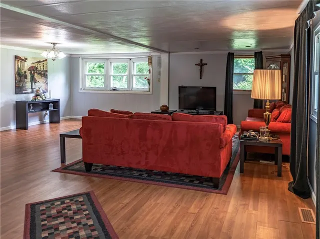 a bedroom with furniture and a fireplace