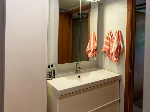 a bathroom with a sink and a mirror