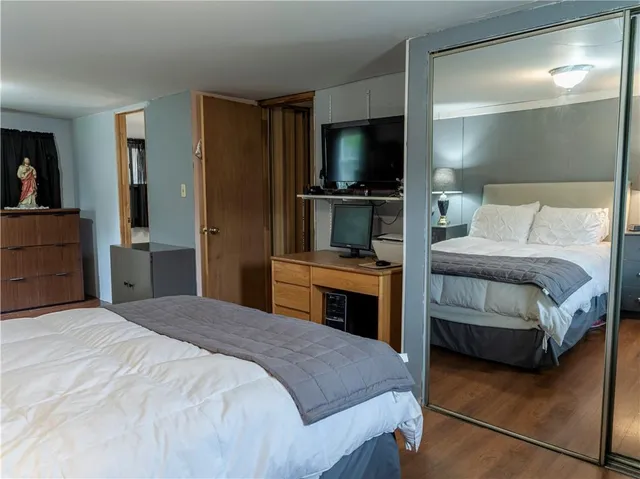 a bedroom with a bed and a television in it