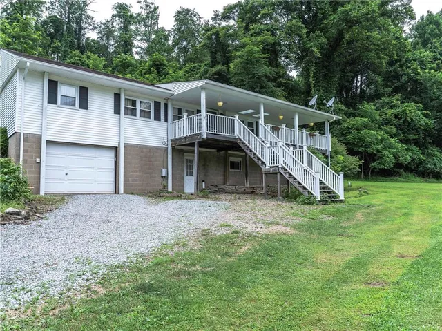 a house with a trees in the background