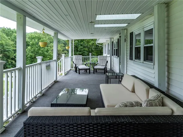 a view of balcony with furniture