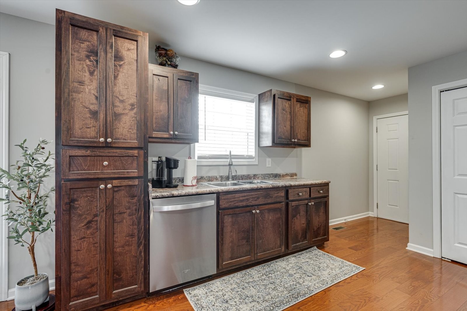 106 Wilder Chapel Road Decherd, TN 37324 - Photo 11 of 29 a kitchen with stainless steel appliances granite countertop a stove a sink and a refrigerator