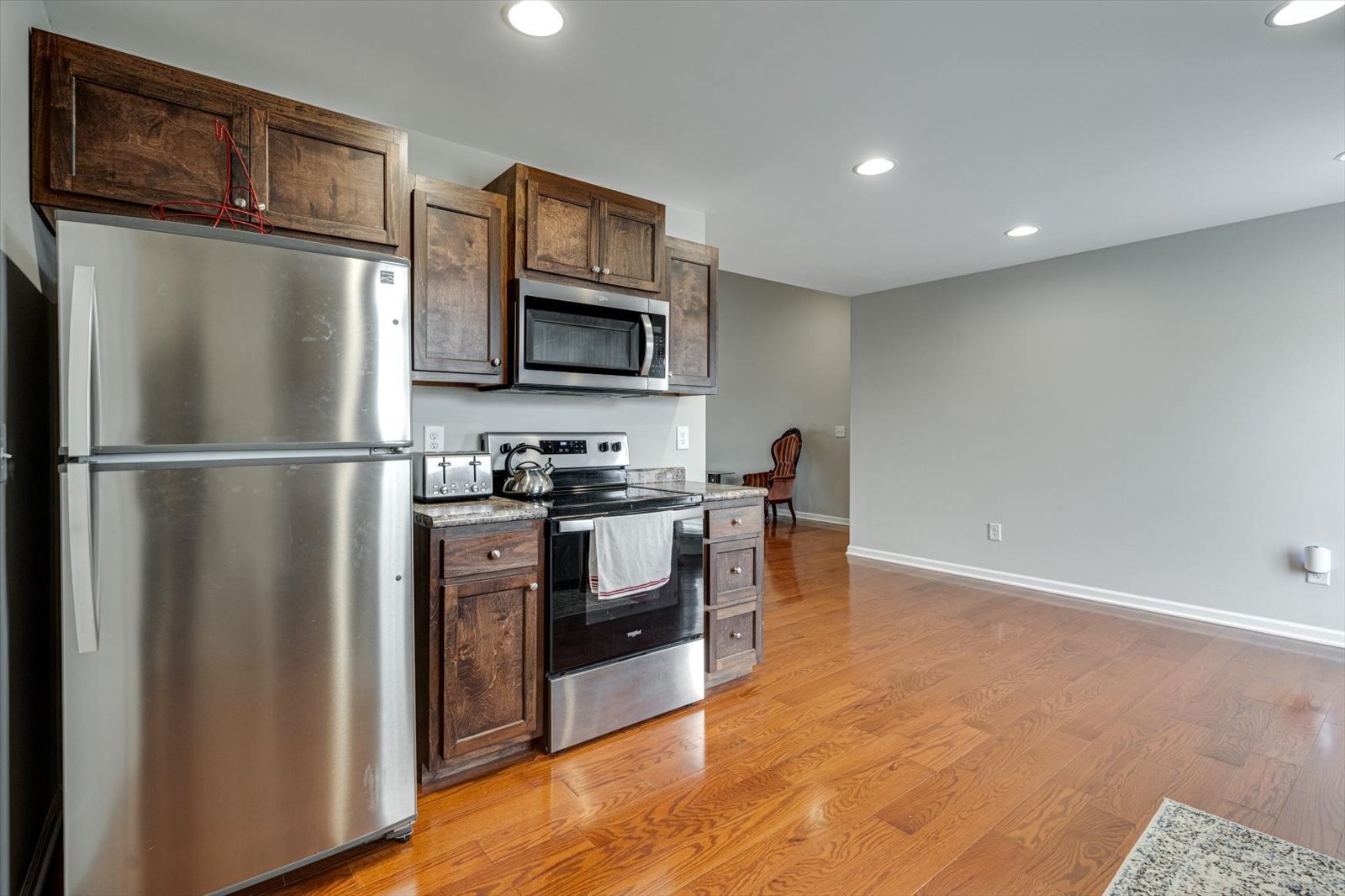 106 Wilder Chapel Road Decherd, TN 37324 - Photo 14 of 29 a kitchen with stainless steel appliances granite countertop a refrigerator microwave and sink