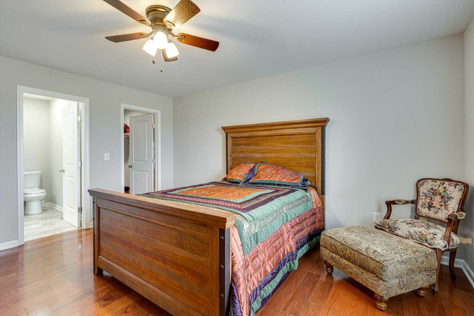 106 Wilder Chapel Road Decherd, TN 37324 - Photo 17 of 29 a bedroom with a bed and a chandelier