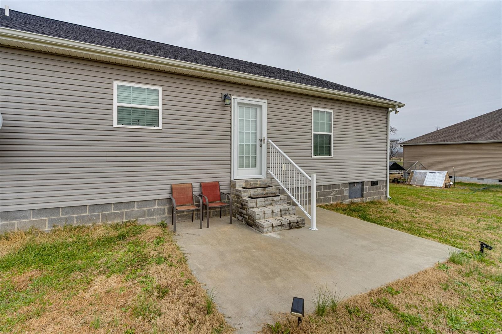 106 Wilder Chapel Road Decherd, TN 37324 - Photo 24 of 29 a backyard of a house with table and chairs