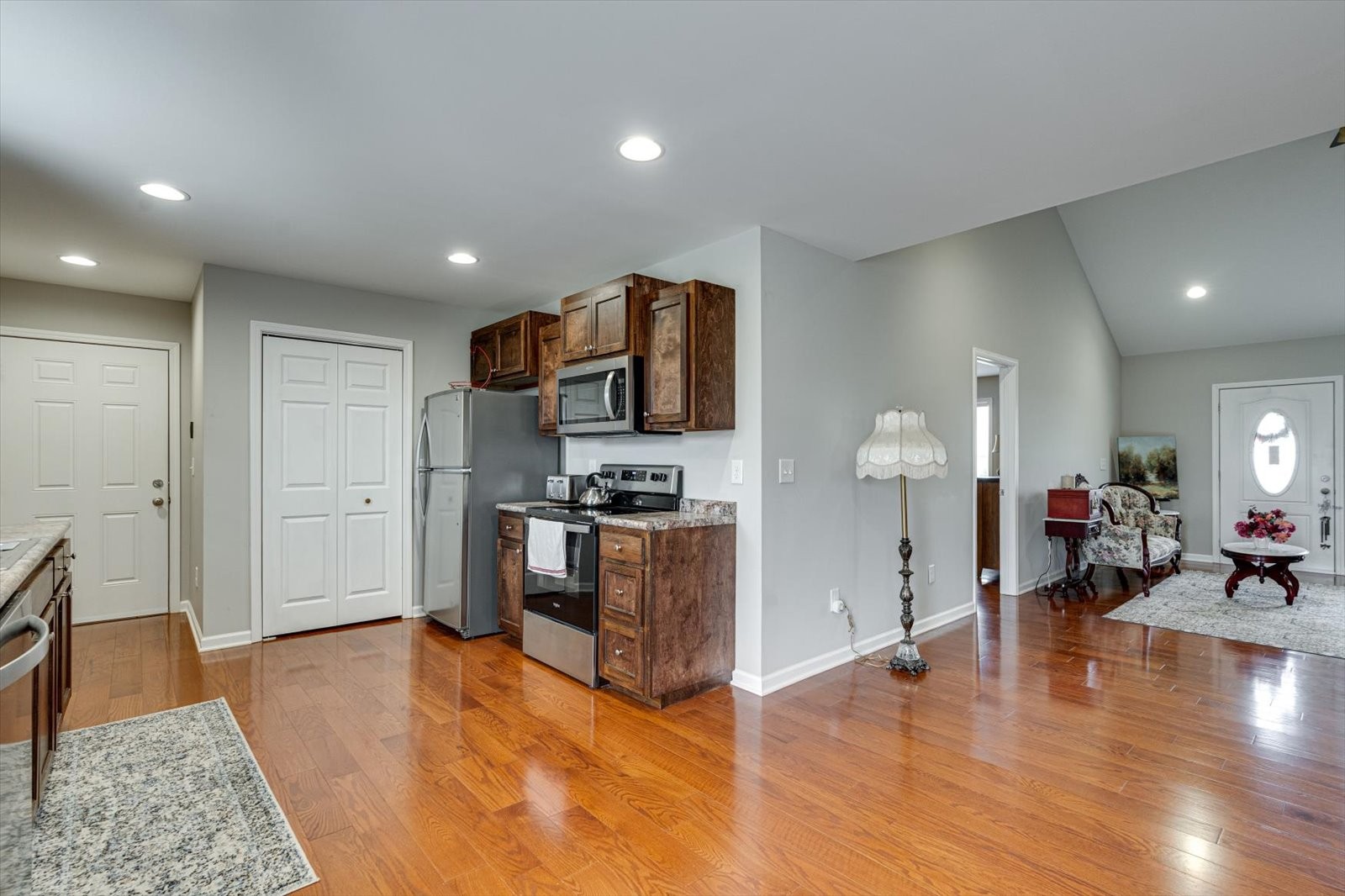 106 Wilder Chapel Road Decherd, TN 37324 - Photo 10 of 29 a living room with stainless steel appliances furniture a fireplace and wooden floor