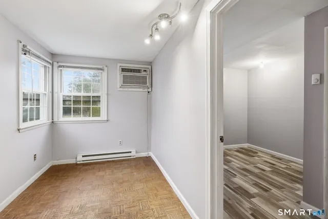 a view of an empty room with windows