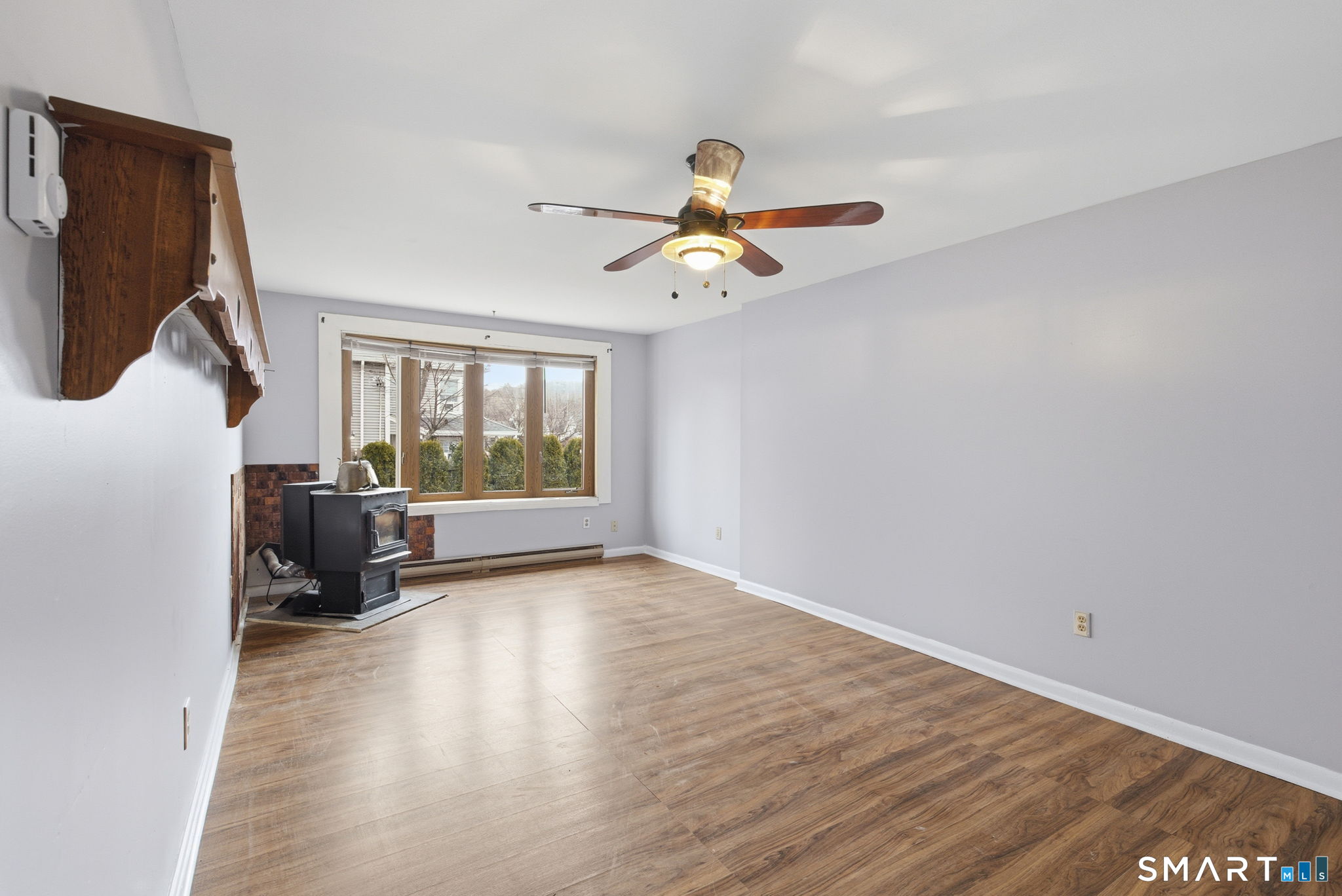 44 East Cedar Street Newington, CT 06111 - Photo 16 of 26 a view of a room with wooden floor ceiling fan