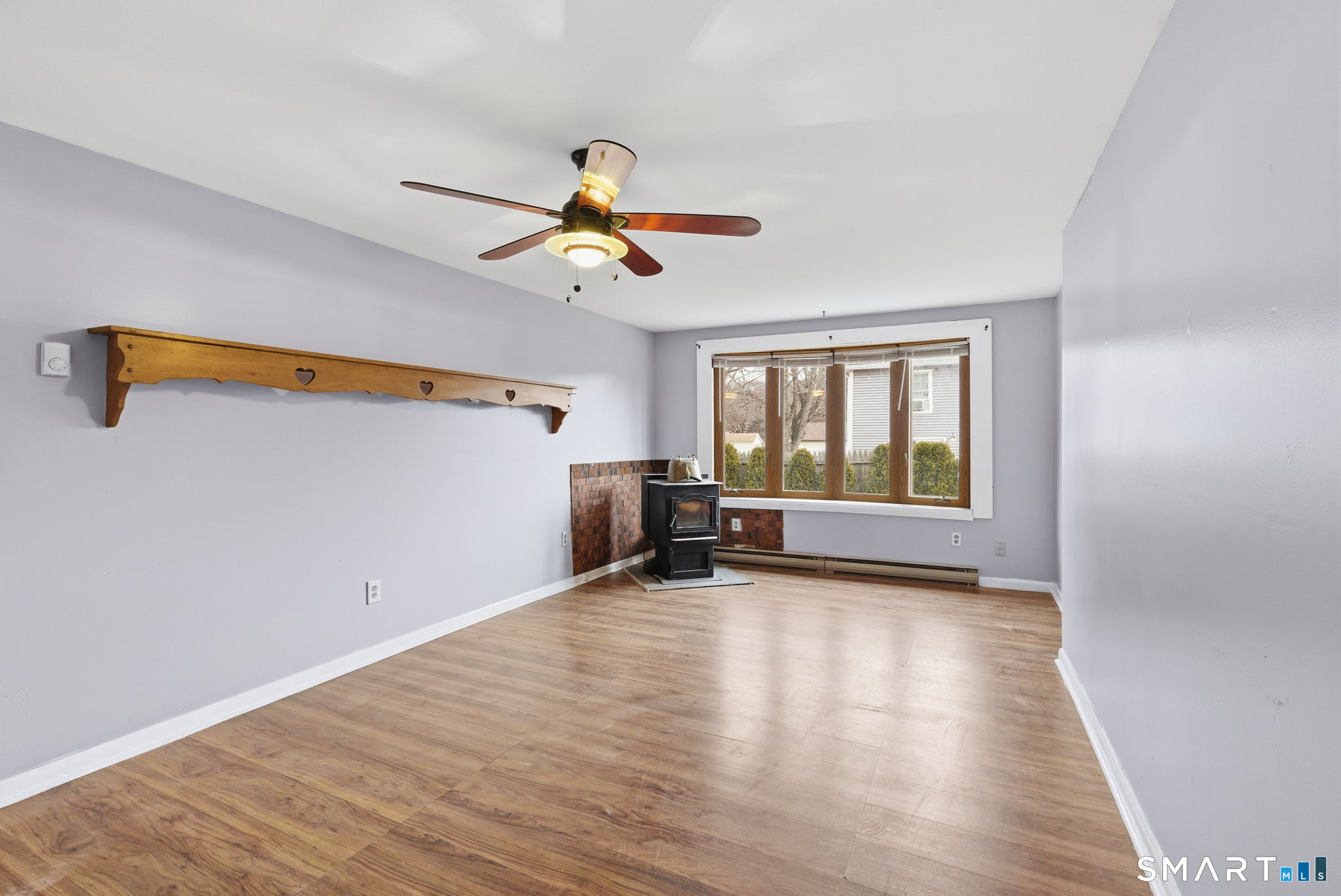 44 East Cedar Street Newington, CT 06111 - Photo 17 of 26 a view of n empty room with window and wooden floor