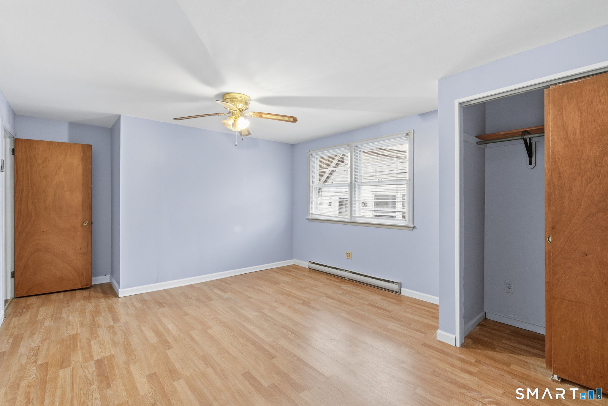 44 East Cedar Street Newington, CT 06111 - Photo 24 of 26 wooden floor in an empty room with a window