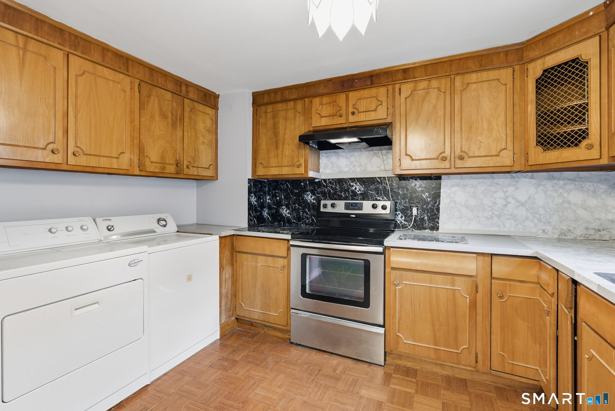 44 East Cedar Street Newington, CT 06111 - Photo 9 of 26 a kitchen with stainless steel appliances granite countertop a sink stove and cabinets