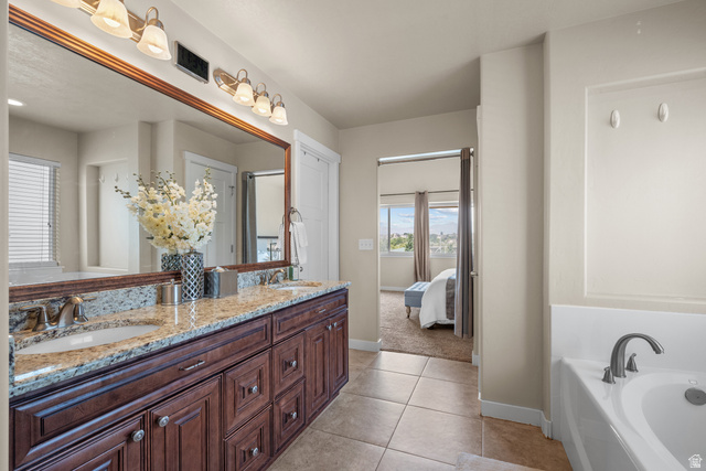 955 Delorean Lane Midvale, UT 84047 - Photo 21 of 47 Dual vanity with granite countertop and dark wood-finish cabinetry