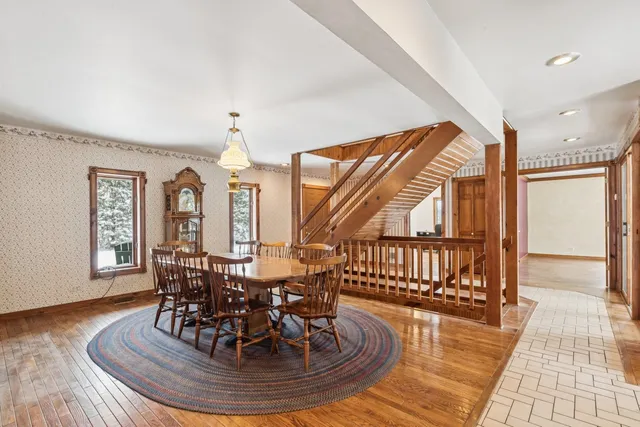 a kitchen with stainless steel appliances granite countertop a refrigerator a sink and a cabinets