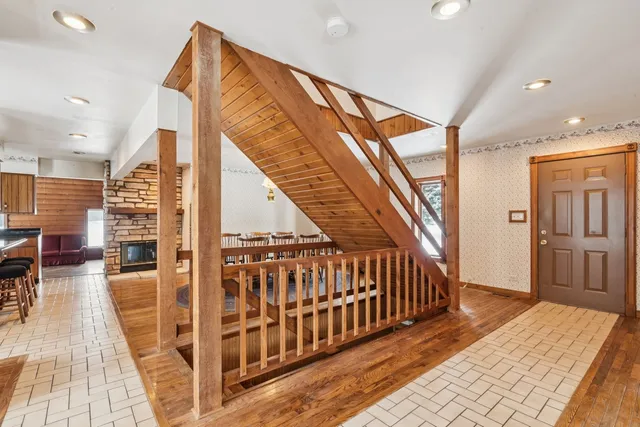 a dining room with furniture window and wooden floor