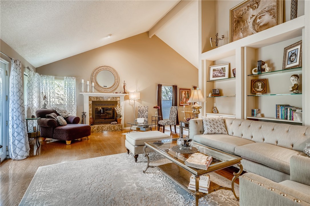 310 Bunny Hop Trail Austin, TX 78734 - Photo 1 of 1 a living room with furniture and a fireplace