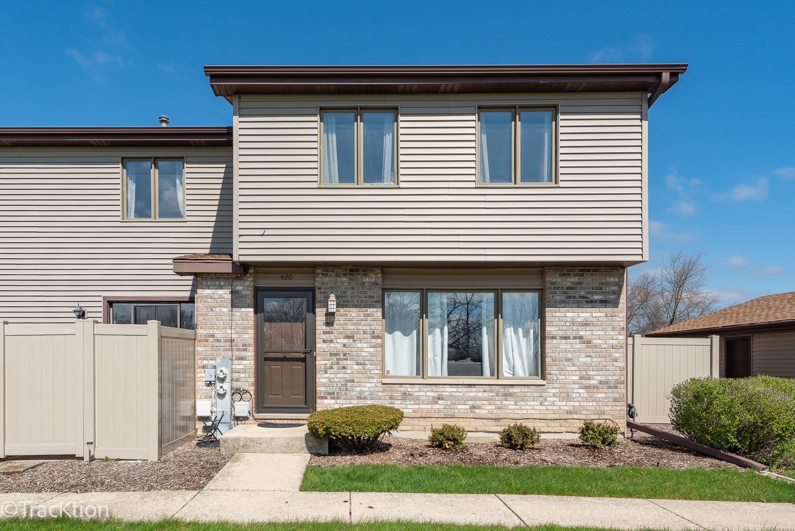 420 Circlegate Road, Unit 420 New Lenox, IL 60451 - Photo 1 of 16 a front view of a house with garden