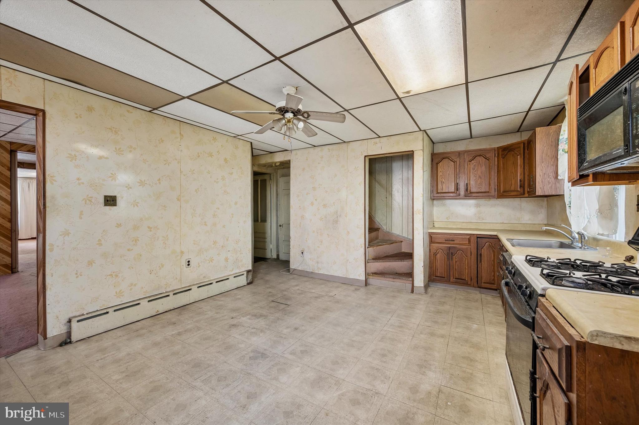 4511 Chester Avenue Philadelphia, PA 19143 - Photo 15 of 35 a kitchen that has a microwave a stove and a sink