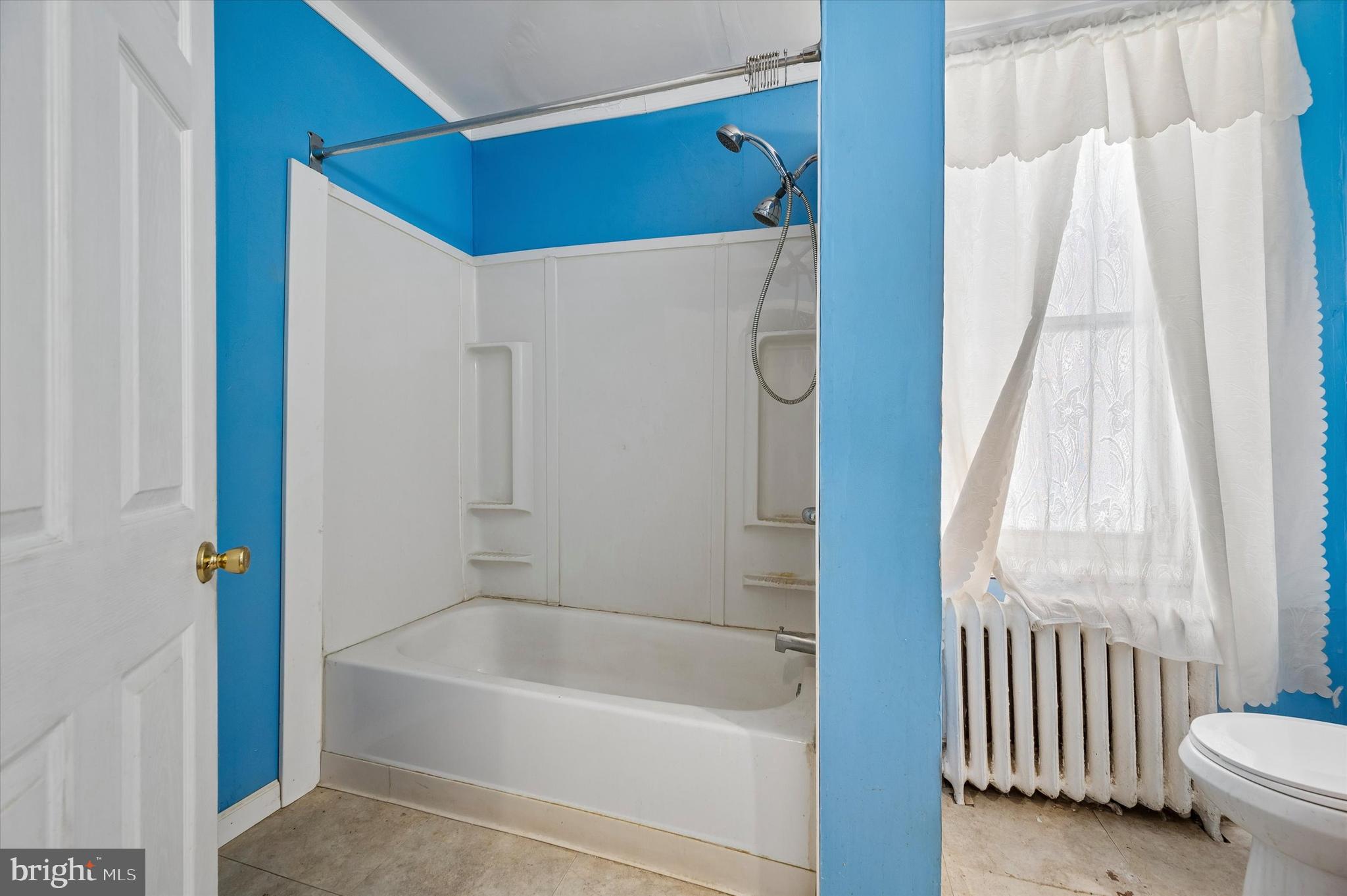 4511 Chester Avenue Philadelphia, PA 19143 - Photo 20 of 35 a bathroom with a bathtub and a shower