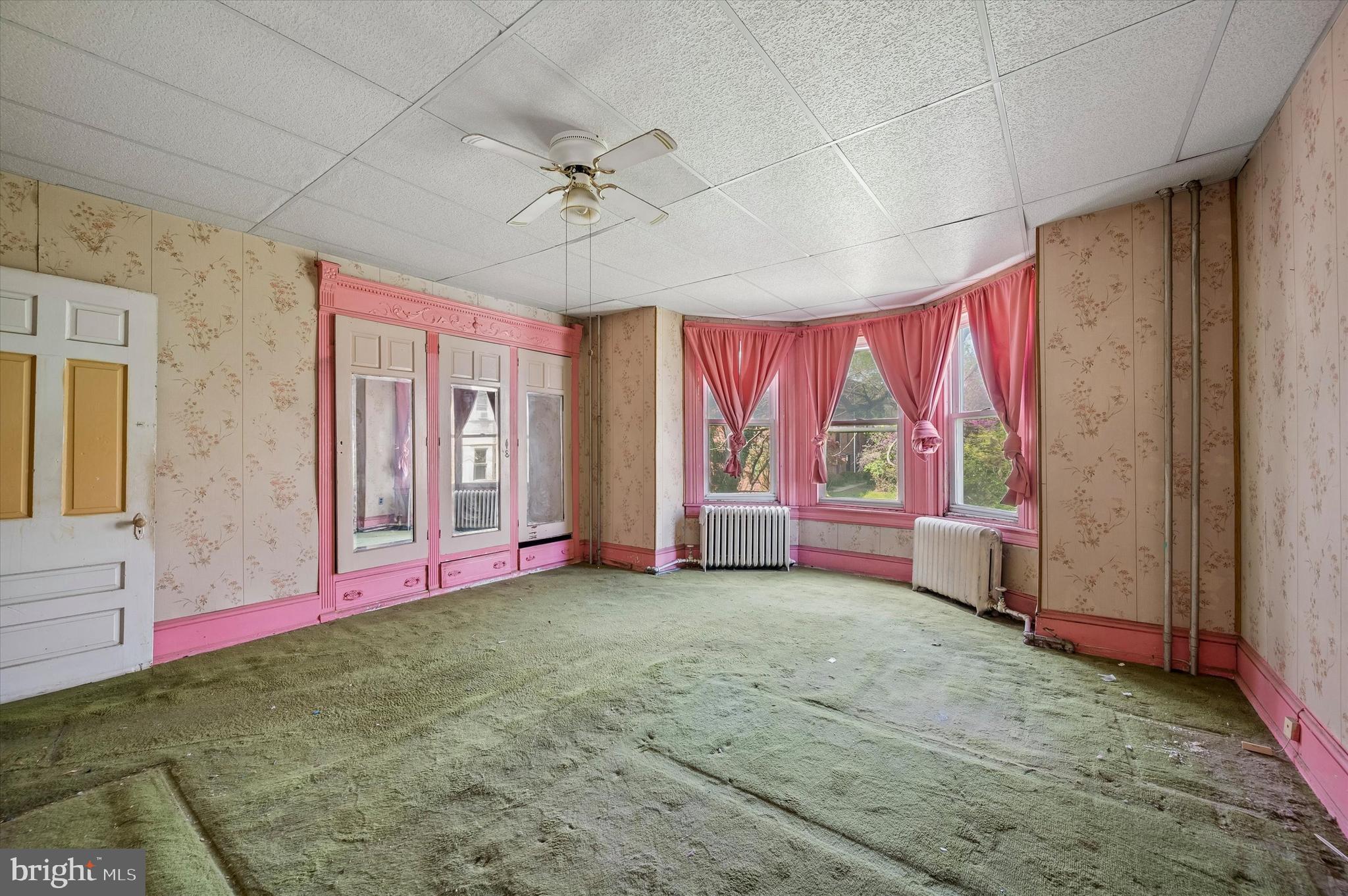 4511 Chester Avenue Philadelphia, PA 19143 - Photo 23 of 35 a bed room with a bed and a large window