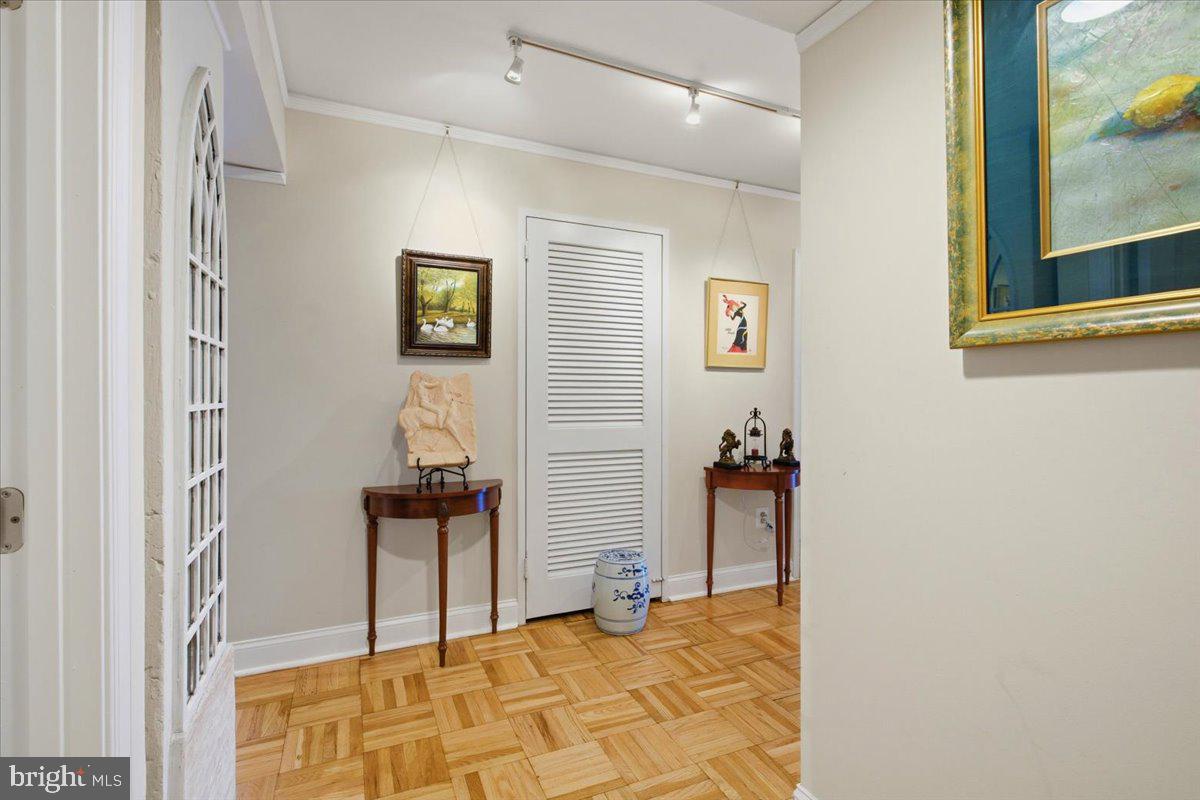 700 7th Street Southwest, Unit 827 Washington, DC 20024 - Photo 2 of 32 Inviting hallway with artistic flair.