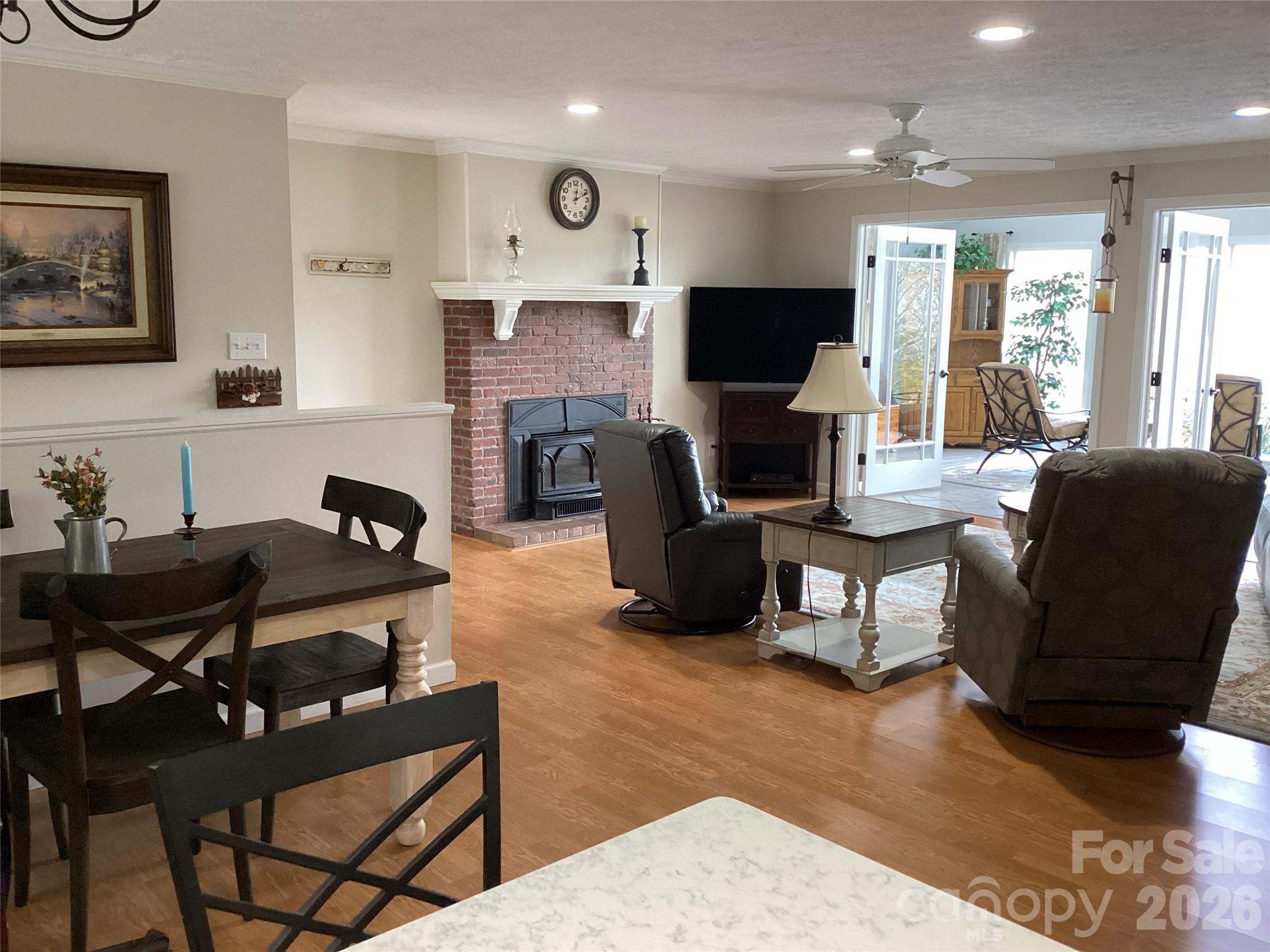 31 Rhododendron Road Black Mountain, NC 28711 - Photo 11 of 27 a living room with furniture a flat screen tv and a fireplace