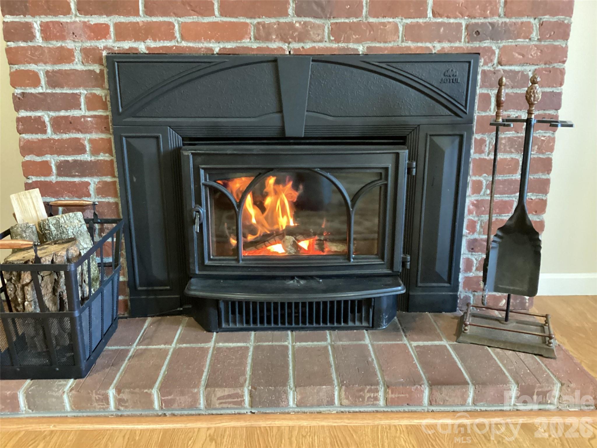 31 Rhododendron Road Black Mountain, NC 28711 - Photo 12 of 27 a black and white photo of a fireplace
