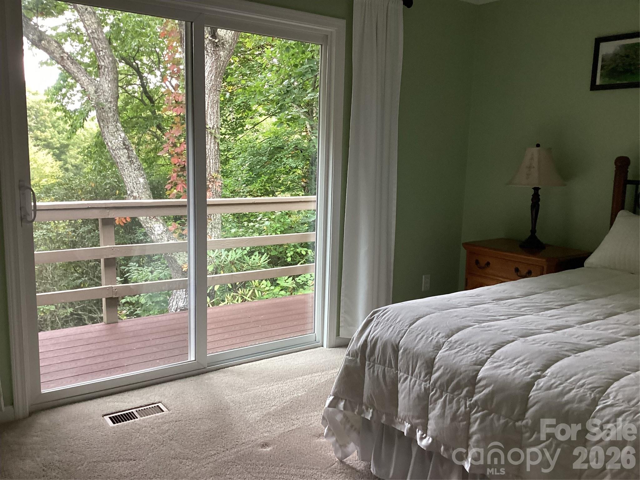 31 Rhododendron Road Black Mountain, NC 28711 - Photo 14 of 27 a bedroom with a bed and a window