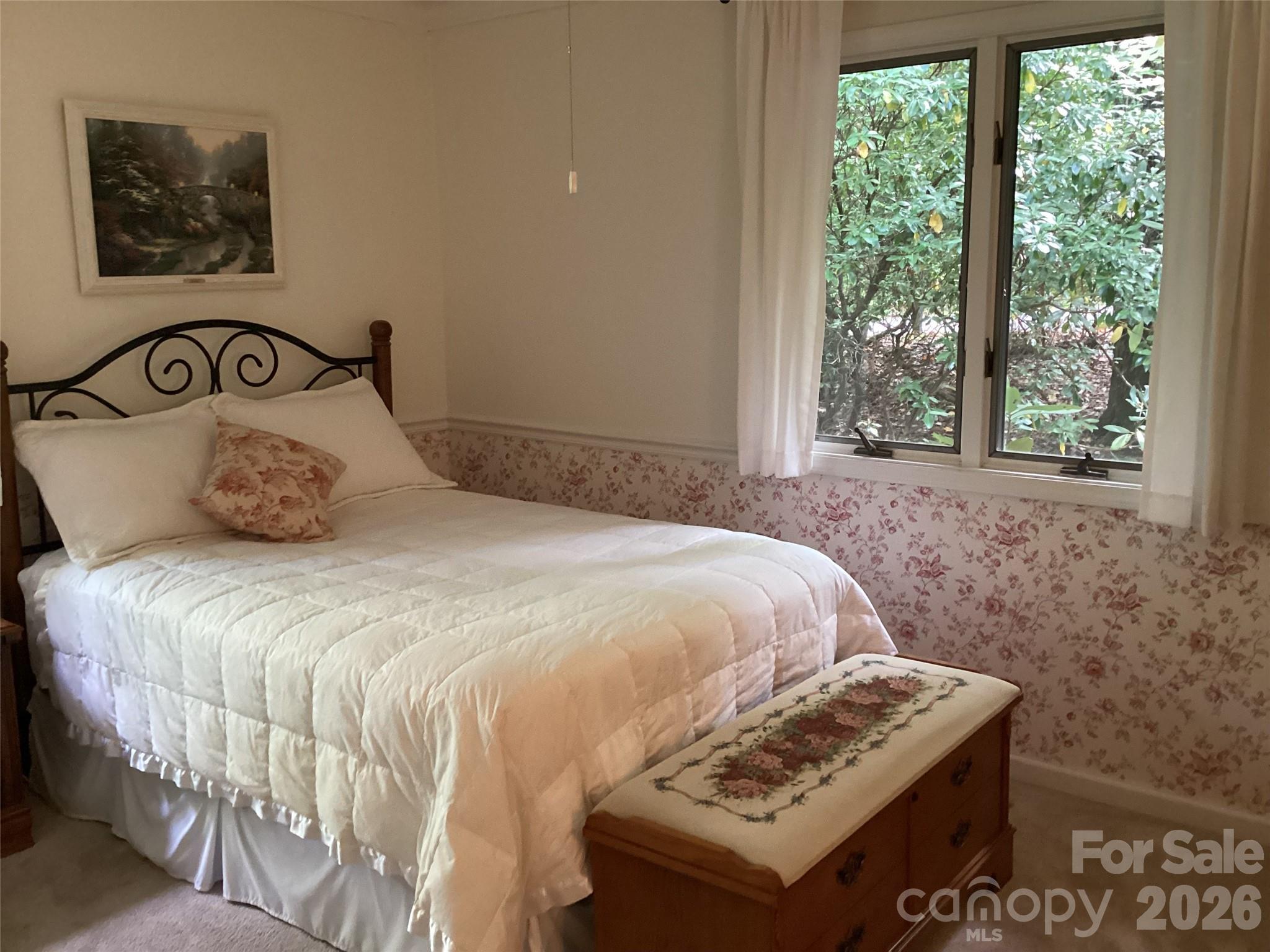 31 Rhododendron Road Black Mountain, NC 28711 - Photo 16 of 27 a bedroom with a bed and a window