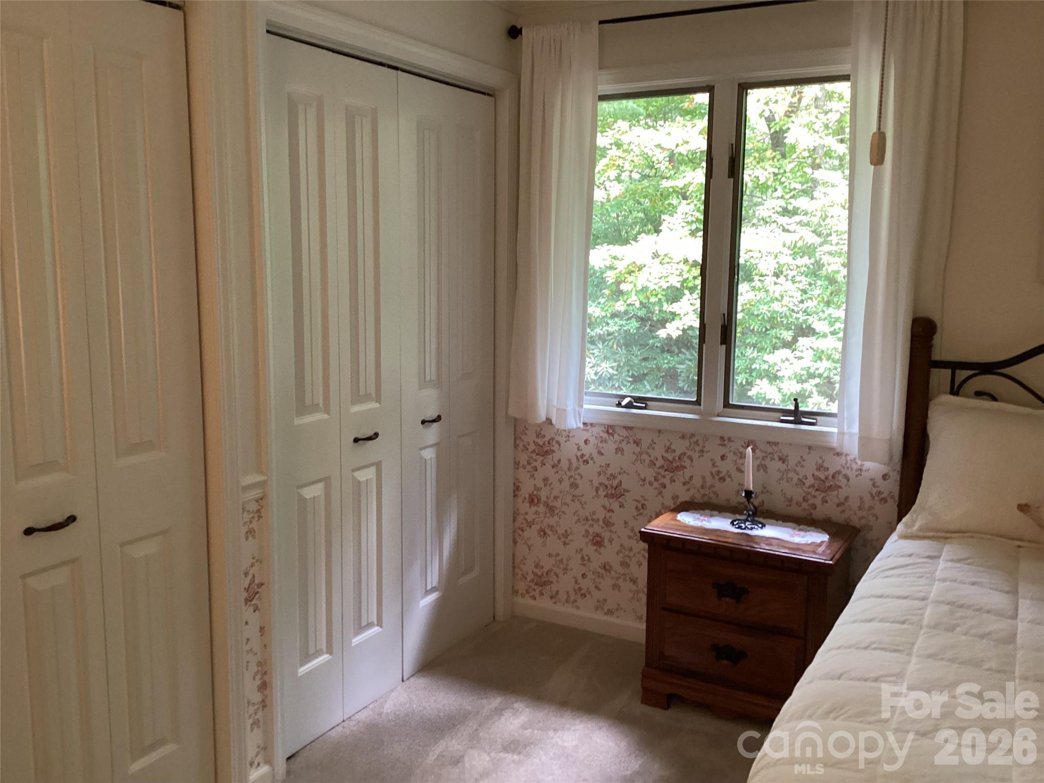 31 Rhododendron Road Black Mountain, NC 28711 - Photo 17 of 27 a room that has a window and a table in it