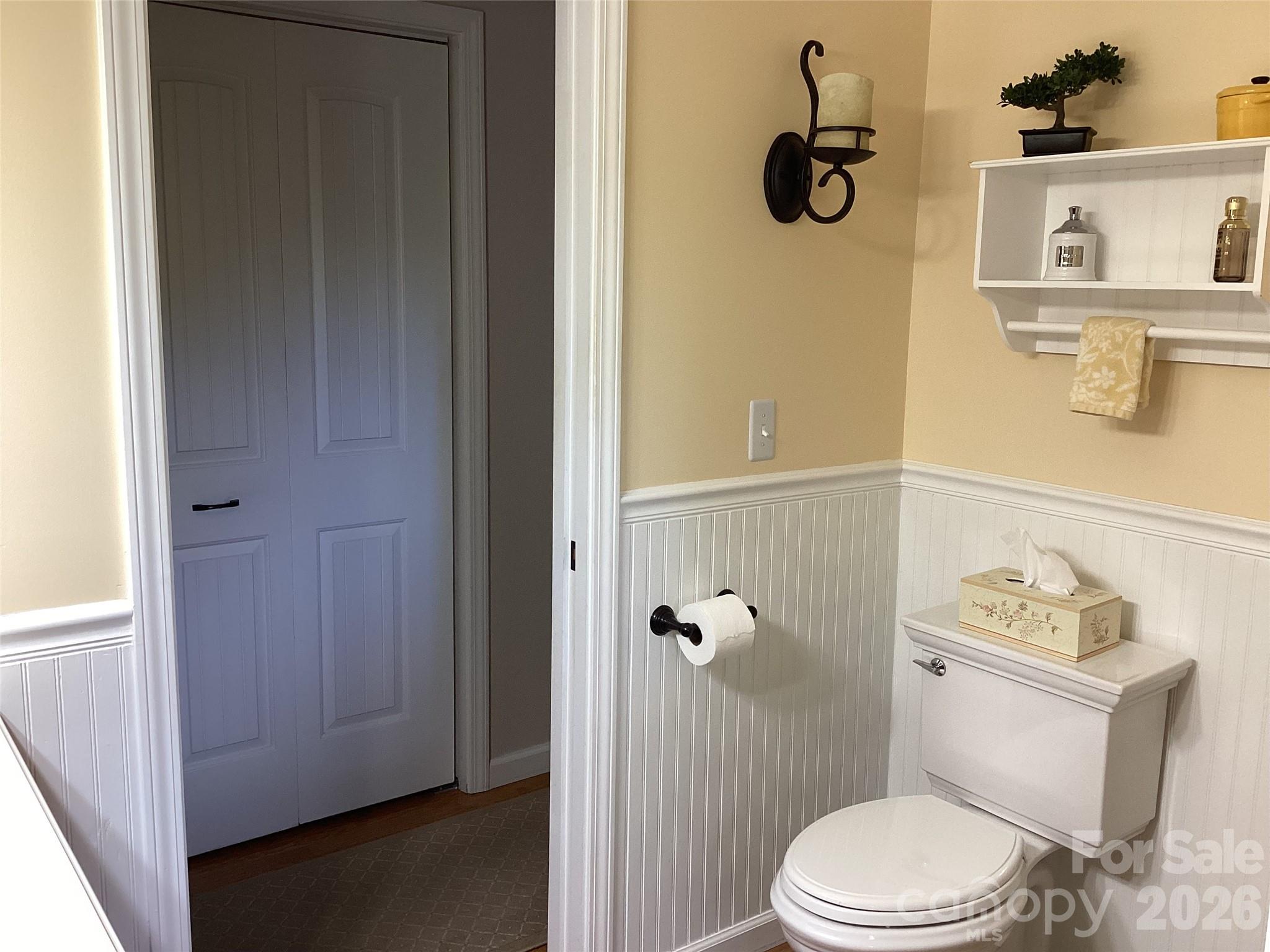 31 Rhododendron Road Black Mountain, NC 28711 - Photo 20 of 27 a white toilet sitting next to a bathroom sink