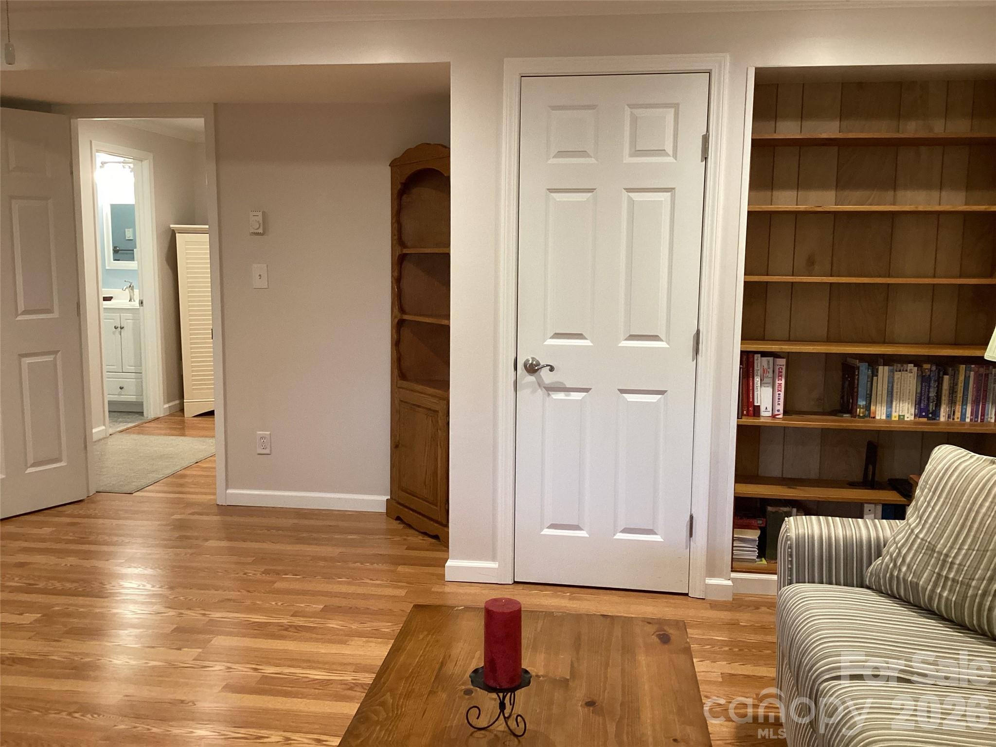 31 Rhododendron Road Black Mountain, NC 28711 - Photo 22 of 27 a living room with furniture and a book shelf