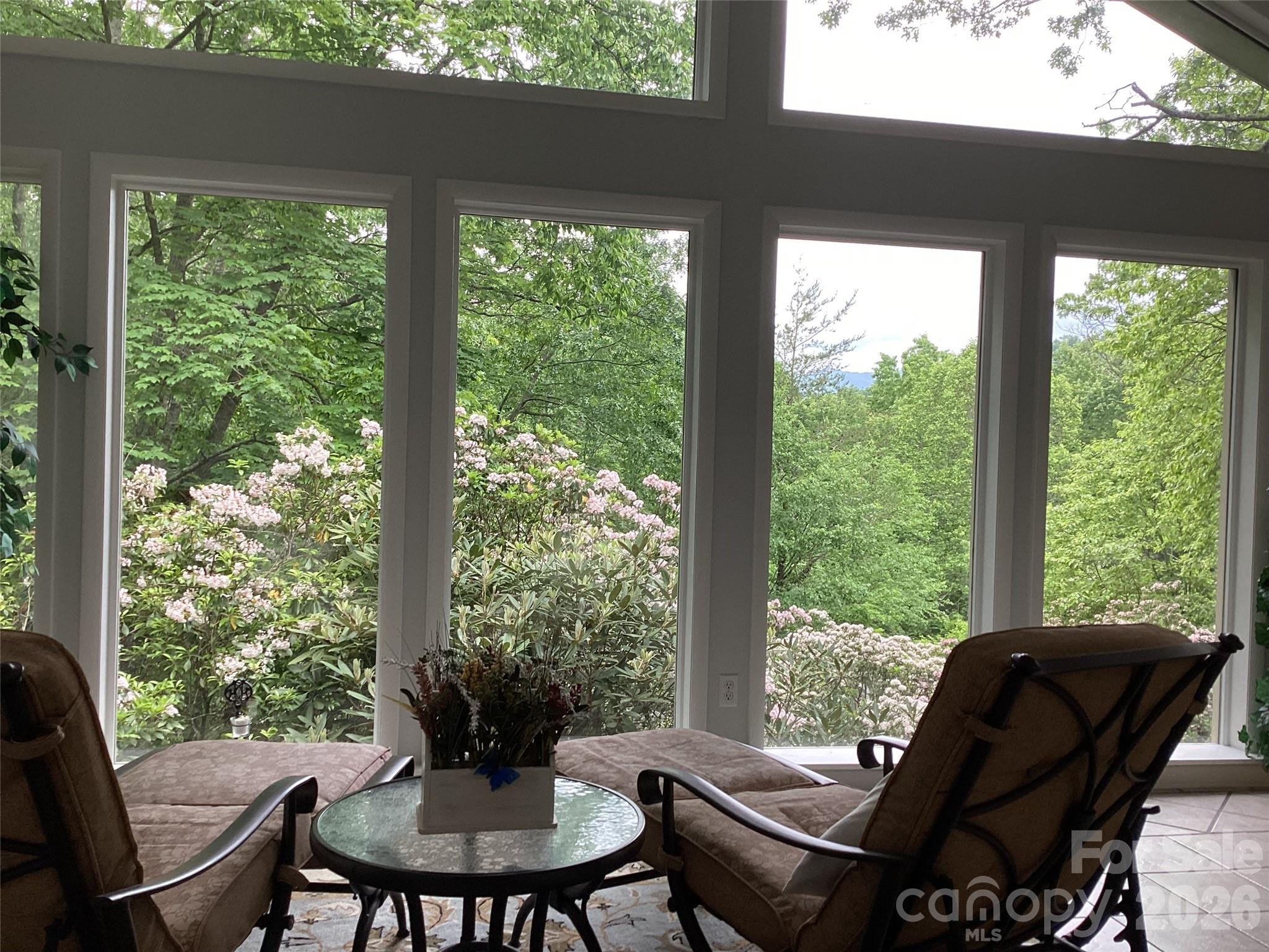 31 Rhododendron Road Black Mountain, NC 28711 - Photo 4 of 27 a view of a dining room with furniture window and outside view