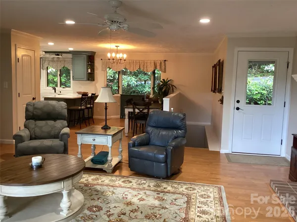 a view of a dining room with furniture and window