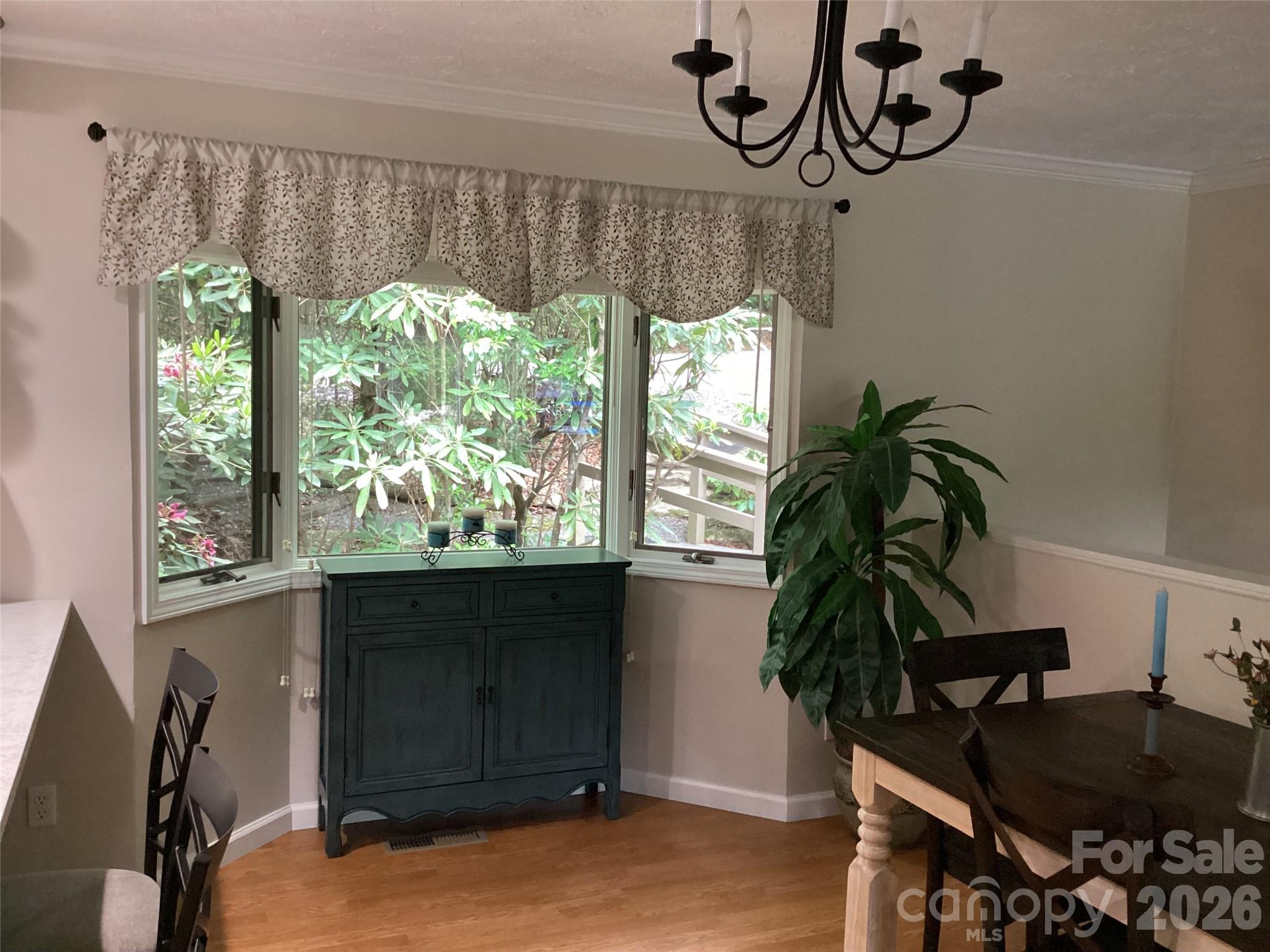 31 Rhododendron Road Black Mountain, NC 28711 - Photo 8 of 27 a dining room with a window and furniture
