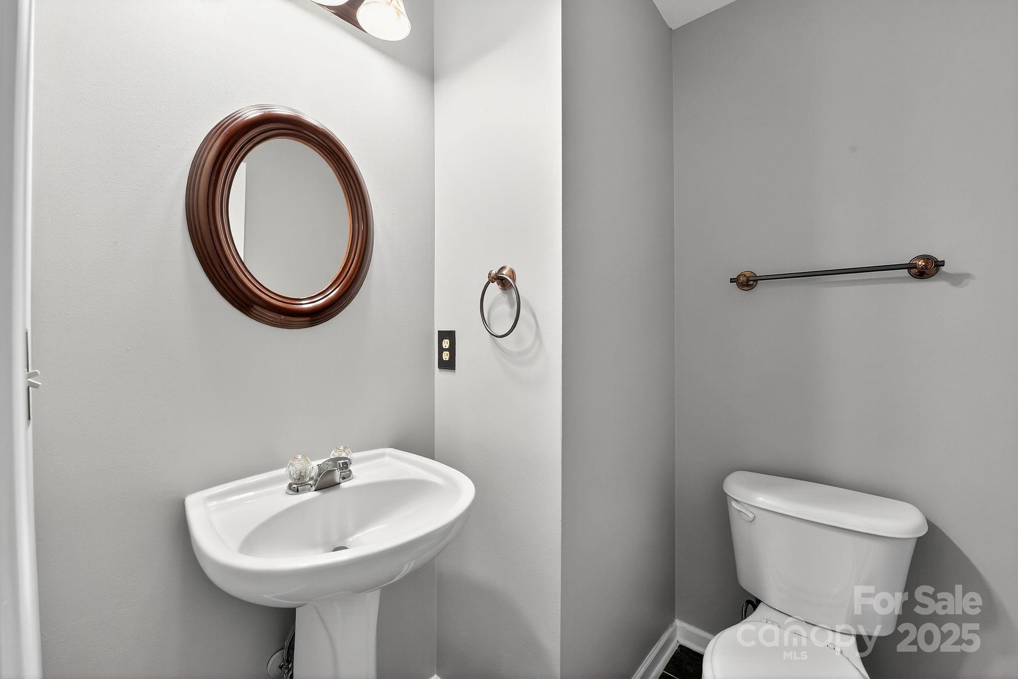 3114 Less Traveled Trail Indian Trail, NC 28079 - Photo 20 of 32 a bathroom with a toilet sink and mirror