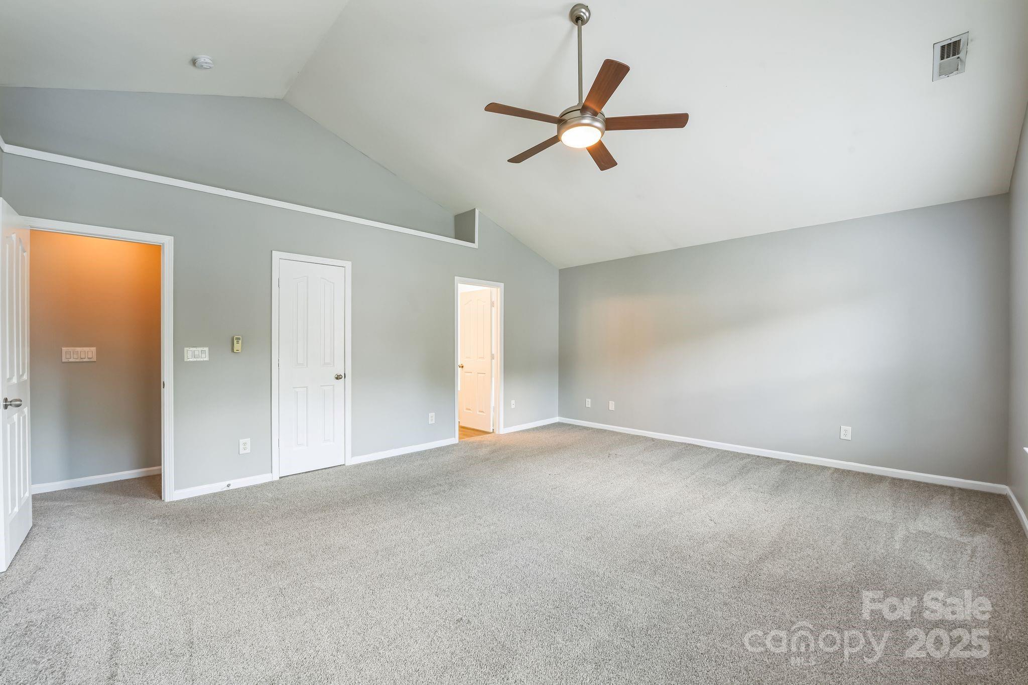 3114 Less Traveled Trail Indian Trail, NC 28079 - Photo 22 of 32 an empty room with a ceiling fan and a window