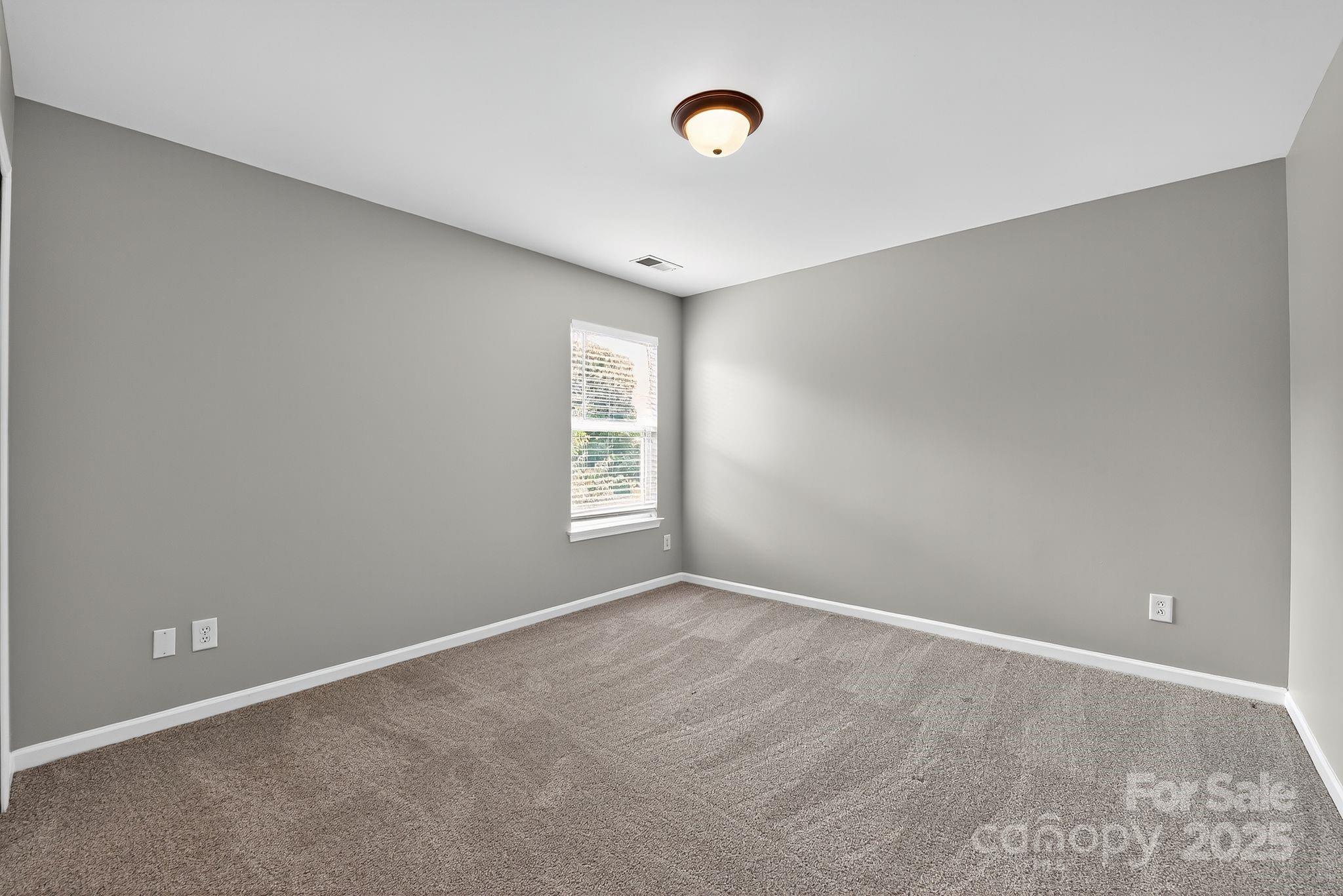 3114 Less Traveled Trail Indian Trail, NC 28079 - Photo 31 of 32 a view of an empty room with a window