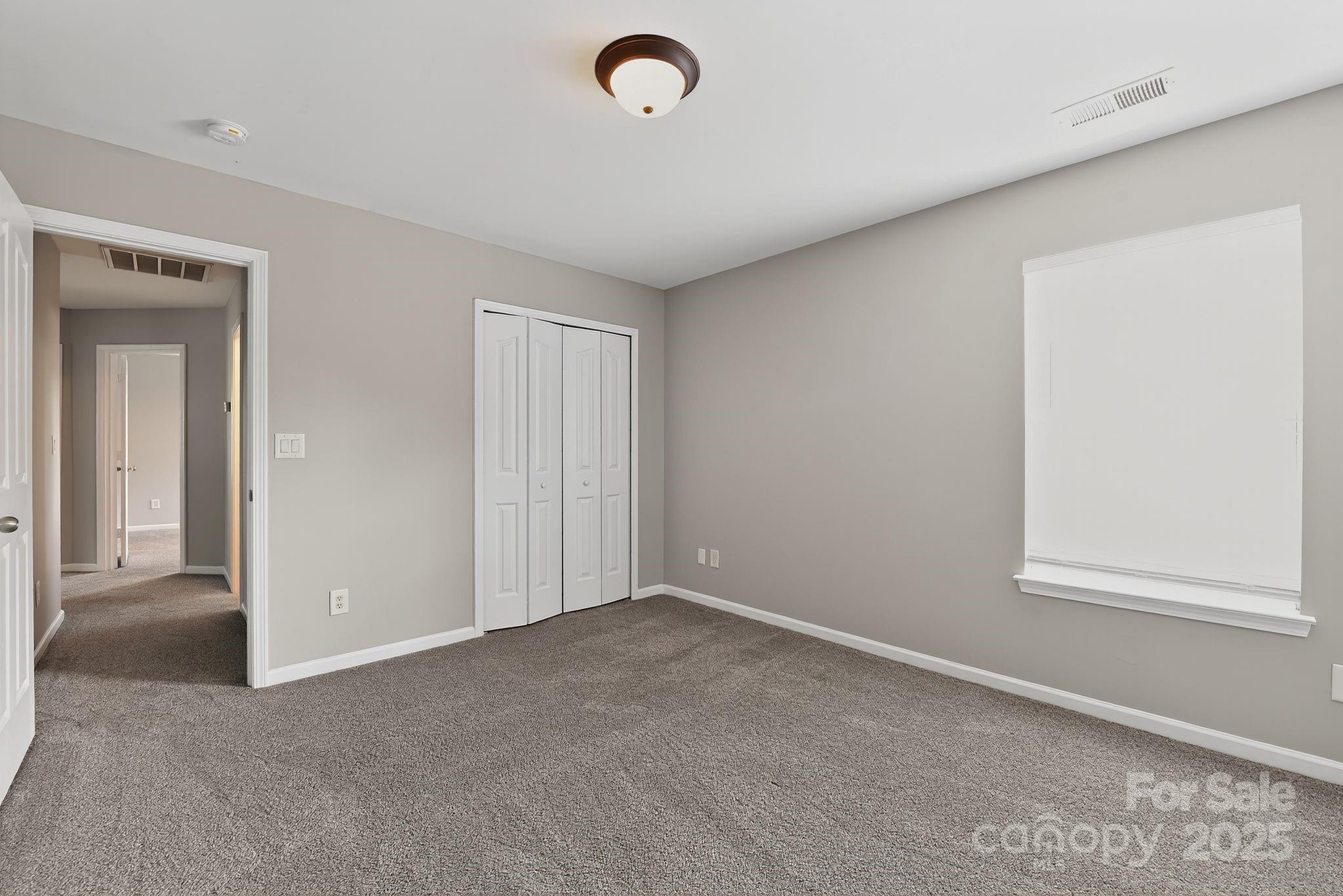 3114 Less Traveled Trail Indian Trail, NC 28079 - Photo 32 of 32 an empty room with windows