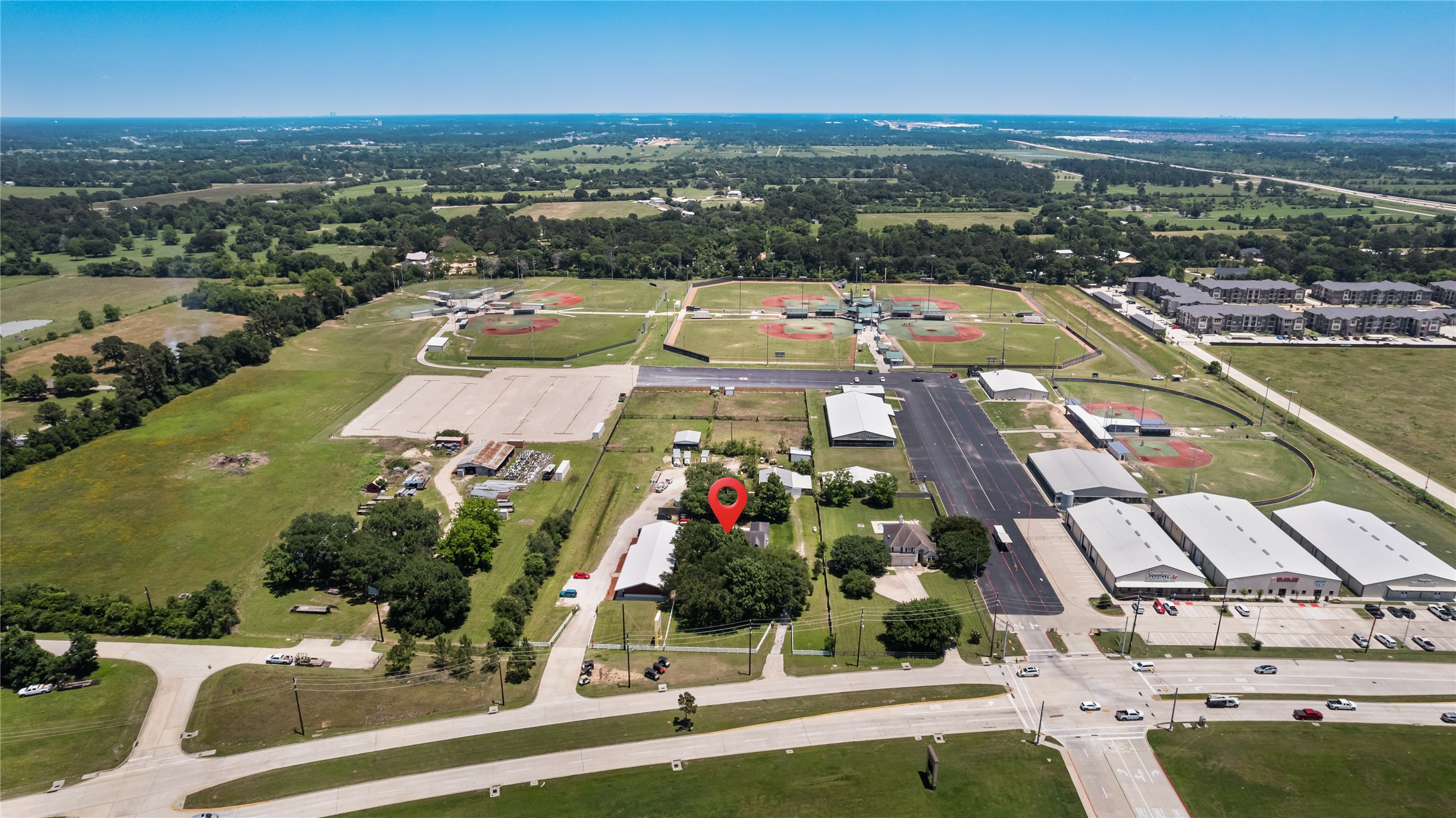 20240 Cypress Rosehill Road Tomball, TX 77377 - Photo 2 of 26 an aerial view of residential houses with outdoor space