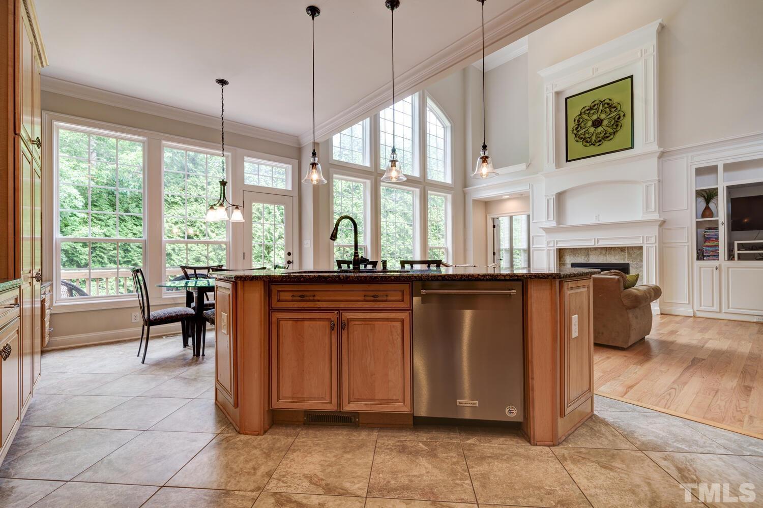 3907 Morvan Way Raleigh, NC 27612 - Photo 16 of 69 a very nice looking living room with a large window and kitchen view