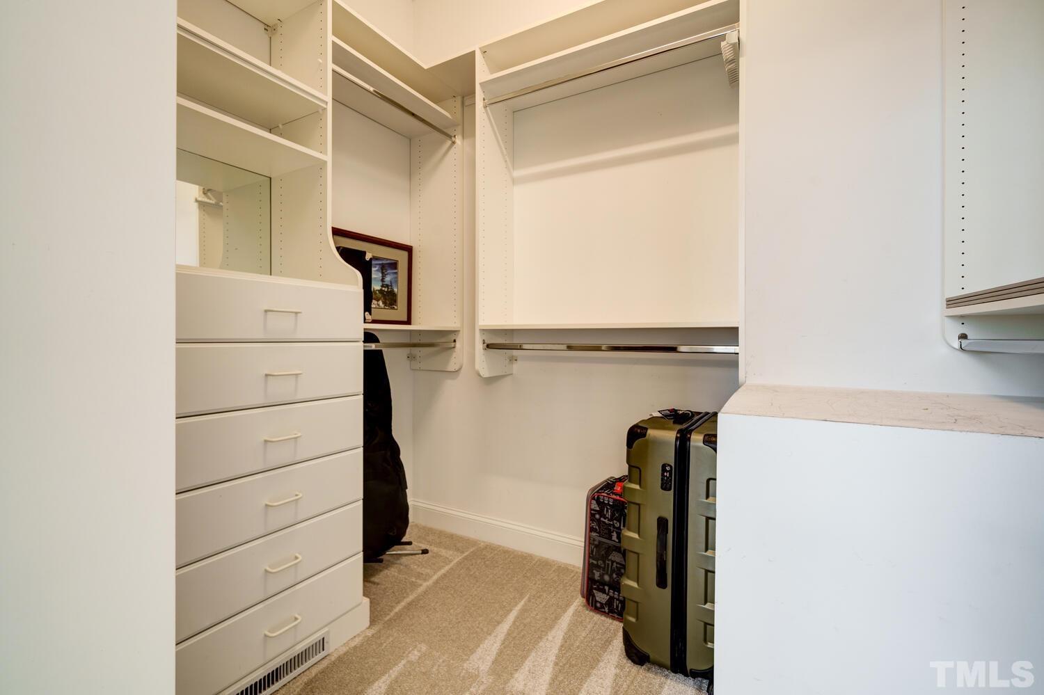 3907 Morvan Way Raleigh, NC 27612 - Photo 27 of 69 a view of walk in closet with clothes and shoes