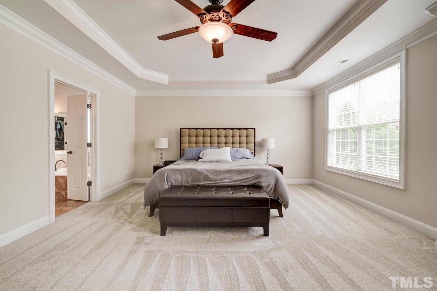 3907 Morvan Way Raleigh, NC 27612 - Photo 30 of 69 a bedroom with a bed and window