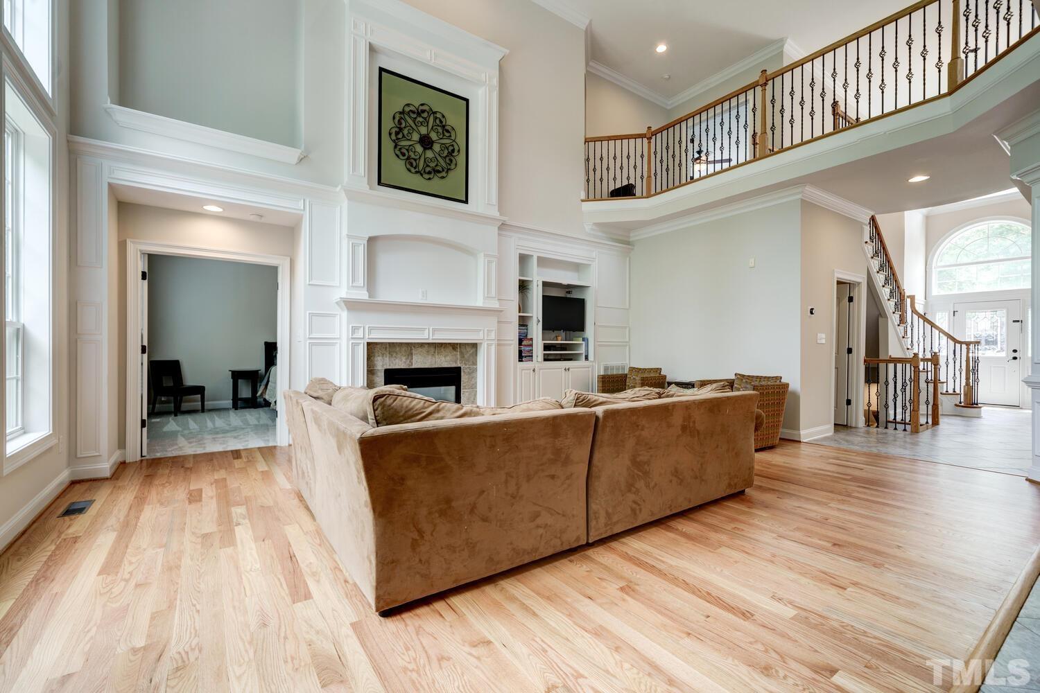 3907 Morvan Way Raleigh, NC 27612 - Photo 3 of 69 a living room with furniture and a fireplace